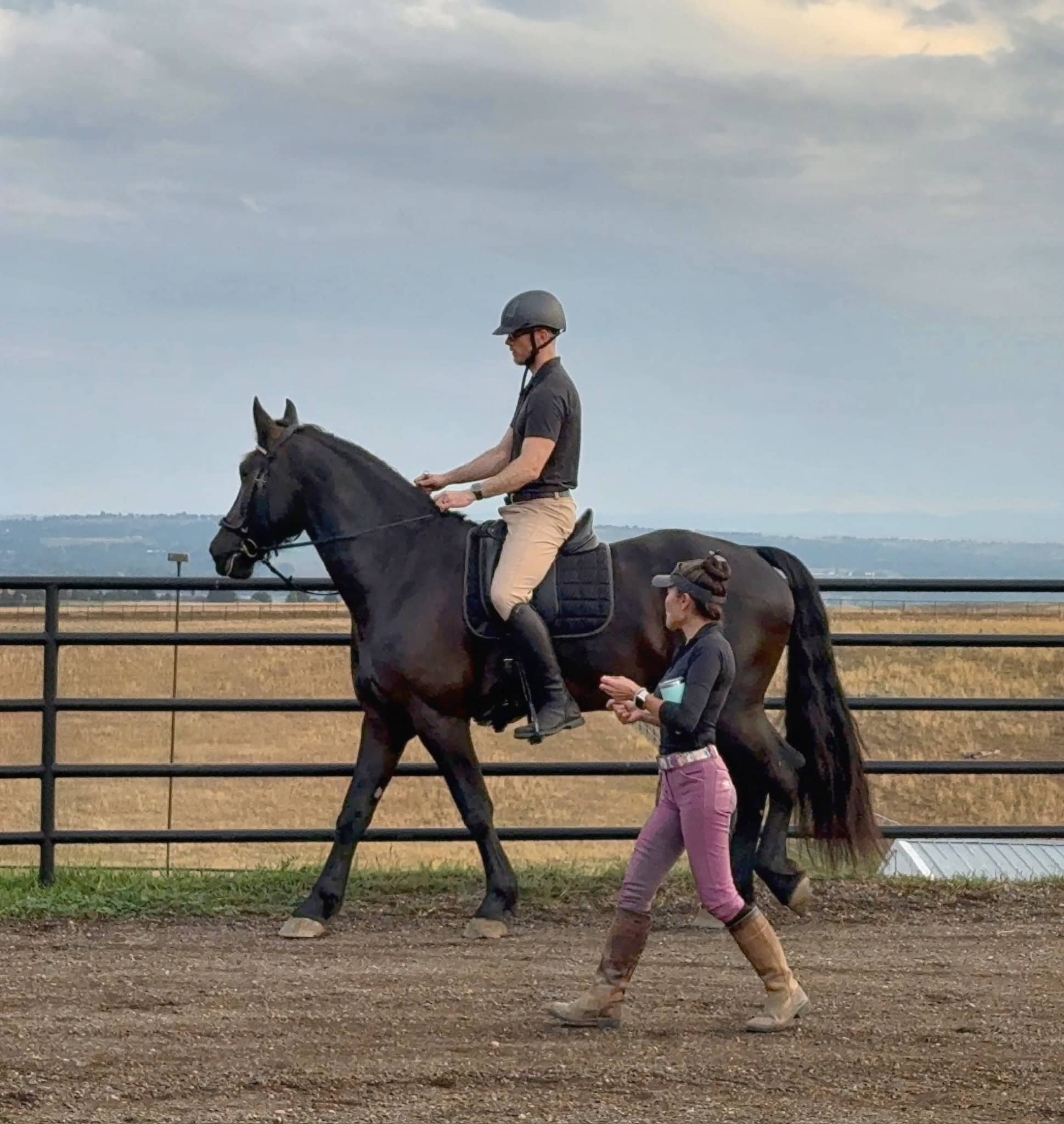 Euki Binns coaching rider during training session, equine instruction and development